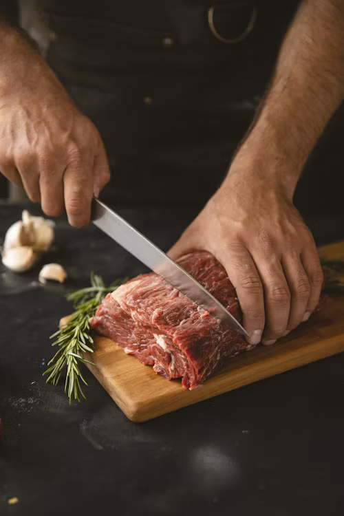 Hands demonstrating knife skills